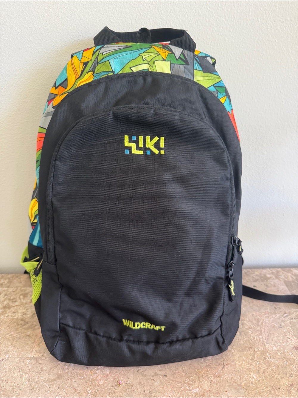 Wildcraft Black Backpack with Colorful Geometric Accent for elementary kids